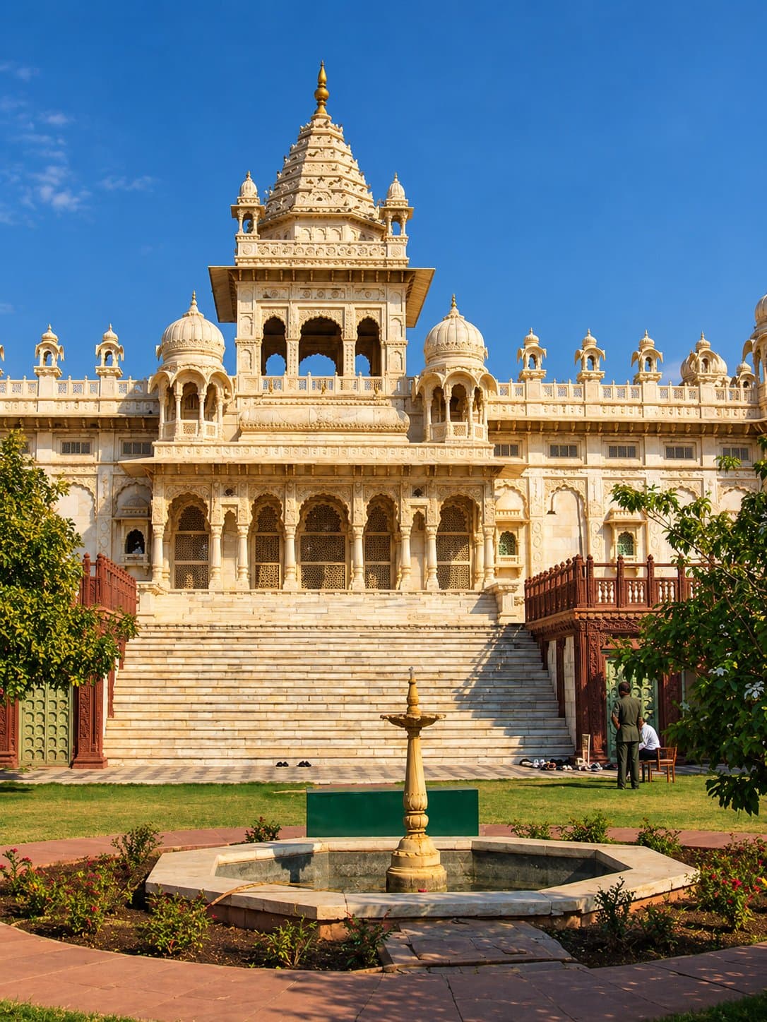The white marble memorial of Jaswant Thada in Jodhpur, with its carved central tower, wide steps and a fountain in the garden in front